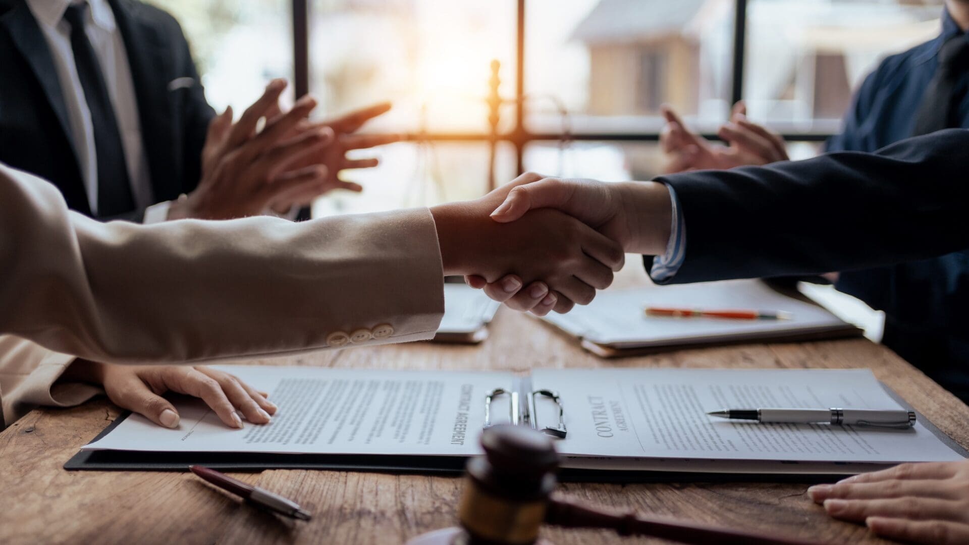 Handshake symbolizing the signing of a strategic partnership between two international companies